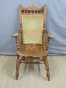 A 19thC Windsor captain's or similar chair with upholstered back