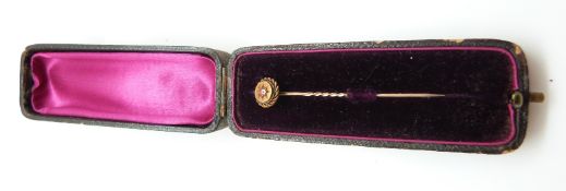 A Victorian/Edwardian 15ct gold stick pin set with a diamond (1.