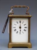 A French late 19thC /early 20thC carriage clock in brass corniche style case.
