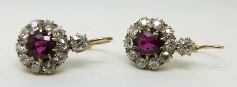 A pair of Victorian earrings set with natural, untreated round cut rubies,
