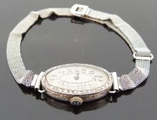 PWC Art Deco Cartier style platinum ladies cocktail wristwatch with Arabic numerals, gold hands,
