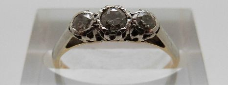 An 18ct gold ring set with three diamonds, size L, 1.