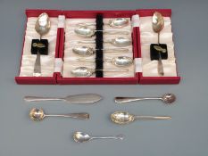 A quantity of Georgian and later hallmarked silver cutlery including nine golf spoons 182g