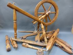A small wooden spinning wheel with shuttles