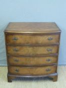 A bow fronted chest of four drawers,