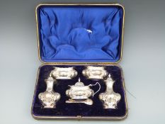 A cased Victorian / Edward VII hallmarked silver five piece cruet set, various dates c1900 to 1903,