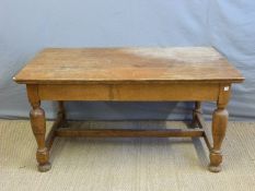 An oak kitchen table with single drawer,