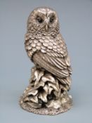 A hallmarked silver figure of an owl, height 7.