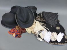 A Victorian silver thread embroidered cloak, top hat, bowler hats,
