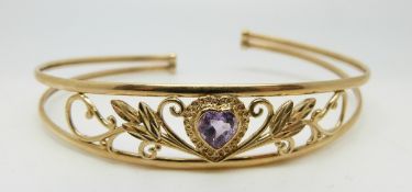 A 9ct gold bangle set with a heart shaped amethyst, 6.