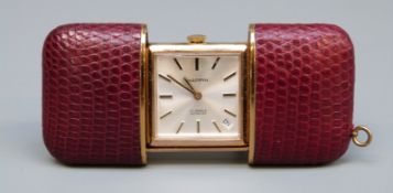 A Mappin and Webb miniature leather bound travel clock