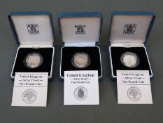 Three Royal Mint UK silver proof cased £1 coins two for 1987, the other 1988,