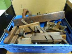 A collection of vintage woodworking planes including plough planes,