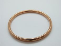 A 9ct gold bangle, 7.