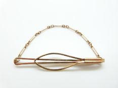 A 9ct gold tie clip, 5.