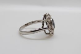An 18ct white gold ring set with a sapphire of approximately 0.