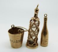 A 9ct gold champagne charm,