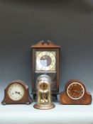 Two oak-cased mantel clocks, one a Smiths Enfield example,