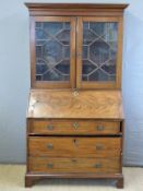 A Georgian flame mahogany bureau having fitted interior,