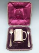 A cased Victorian hallmarked silver christening set comprising tankard, spoon and fork,
