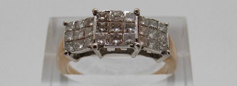 A 9ct gold ring set with princess cut diamonds in three square sections, size P, 3.