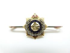 A 9ct gold regimental brooch