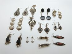 A collection of Indian silver earrings and silver earrings marked Mexico,