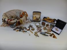 A collection of costume jewellery including amber, agate and mother of pearl necklaces,