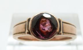 A Victorian ring set with a round cut almandine garnet, size L/M, 3.