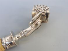 A French white metal ivory handled ham holder or clamp, with lion's claw decoration to clamp,