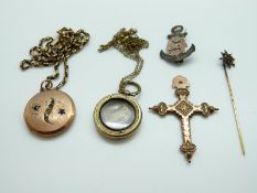 A yellow metal stick pin with sphere design, a yellow metal chain, two Victorian lockets,