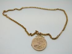 A 9ct gold (back and front) Victorian locket and a 9ct gold chain