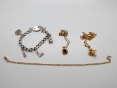 A Steiff bear necklace, silver charm bracelet,