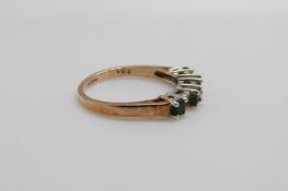 A 9ct gold ring set with emeralds and diamonds, size L,
