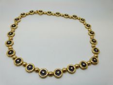 An 18ct gold necklace of alternating spheres,