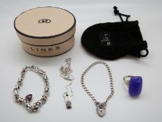 A Links of London silver bracelet, silver ring set with large purple cabochon,