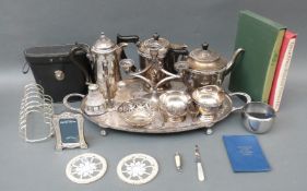 A quantity of silver plated ware to include twin handled tray, teaware, toast rack, coins,