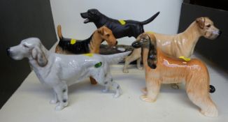 Four Beswick dogs including English Setter, Afghan Hound, and Boxer,
