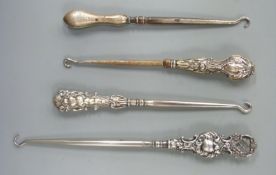Four various hallmarked silver handled button hooks