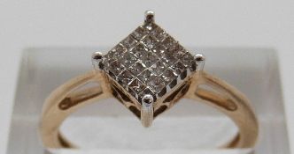 A 10k gold ring set with square cut diamonds in a square shaped setting, size N, 2.