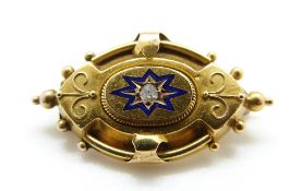 A Victorian brooch set with a diamond surrounded by blue enamel, 3.
