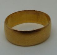 A 22ct gold wedding band, 7.