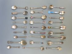 A quantity of white metal collector's spoons including examples marked sterling,