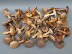 Approximately 50 19th and 20thC turned wood/treen darning or sewing mushrooms including boxwood,