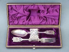 A cased silver plated christening set comprising spoon,
