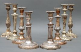 Four pairs of plated candlesticks including an extending Sheffield plate pair