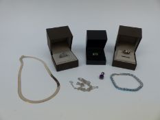 A collection of silver jewellery to include necklace, a bracelet set with topaz, chain, pendant,