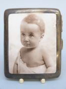 An Edward VII hallmarked silver and pictorial enamel cigarette case,