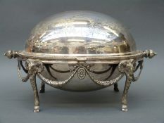 A silver plate warming dish with goat head and swag decoration,