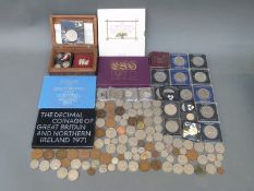 A UK coin collection comprising four Royal Mint brilliant uncirculated coin sets,